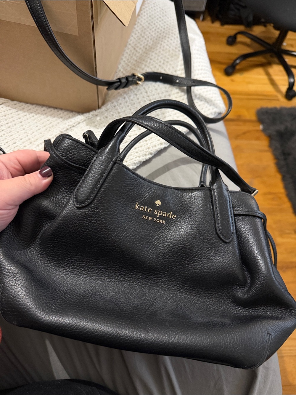 kate spade black leather satchel with gold logo
